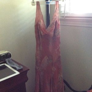 A semi-formal maxi dress with a ruffled hemline.